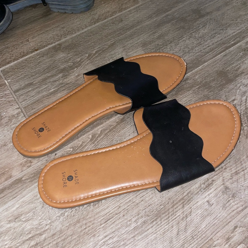 Target brand flat sandals. Leather look Black and Tan scalloped edge